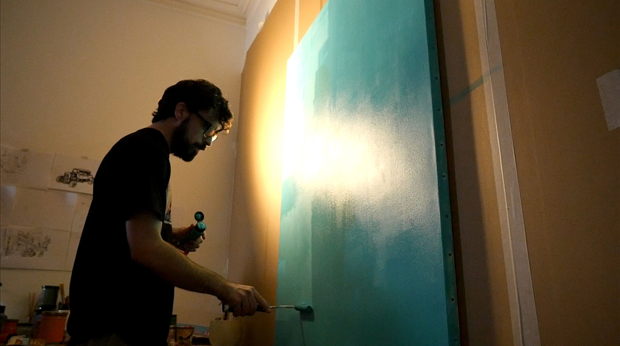 alex kanos painting a canvas