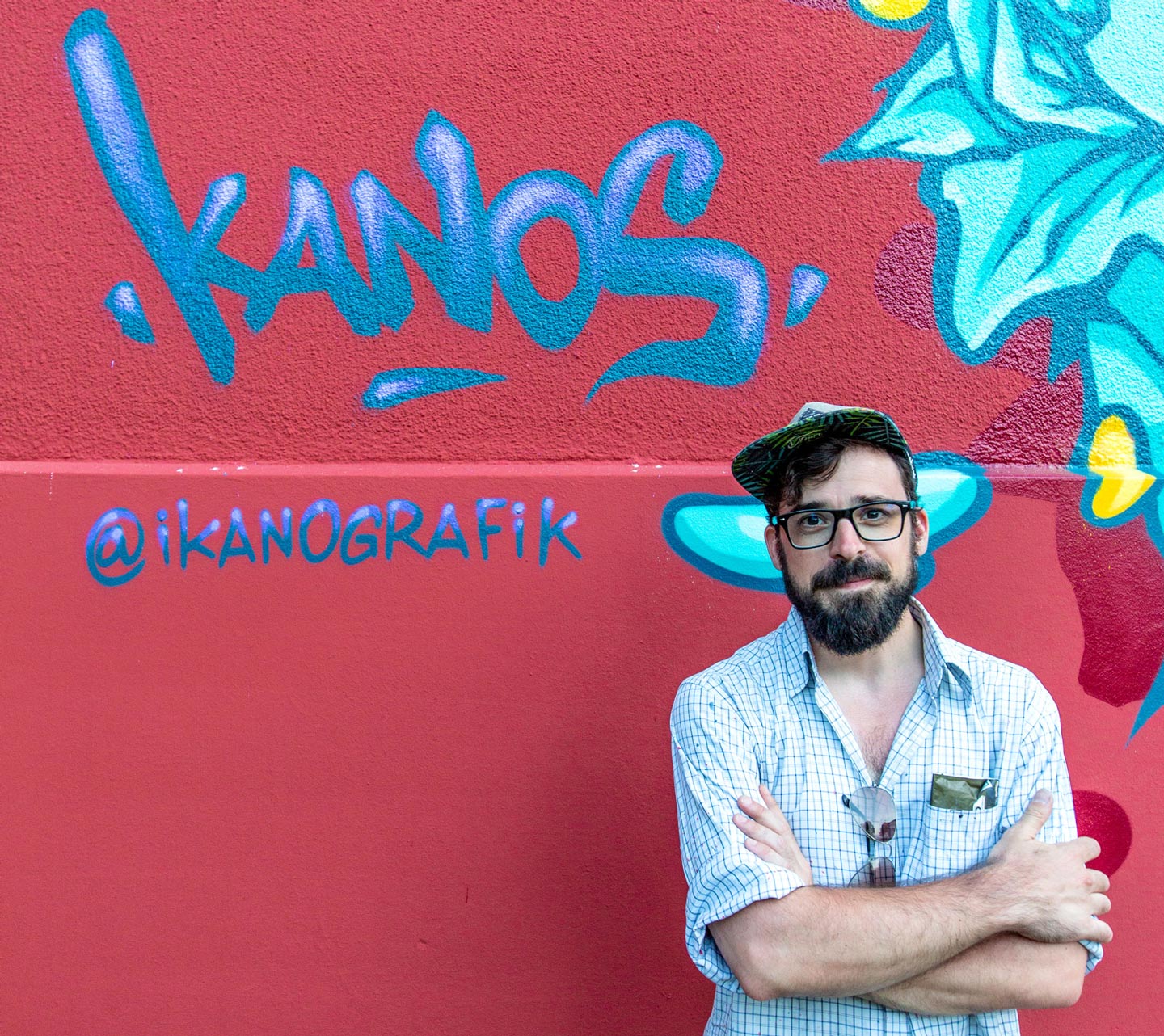 a portrait of alex kanos with his tag in background