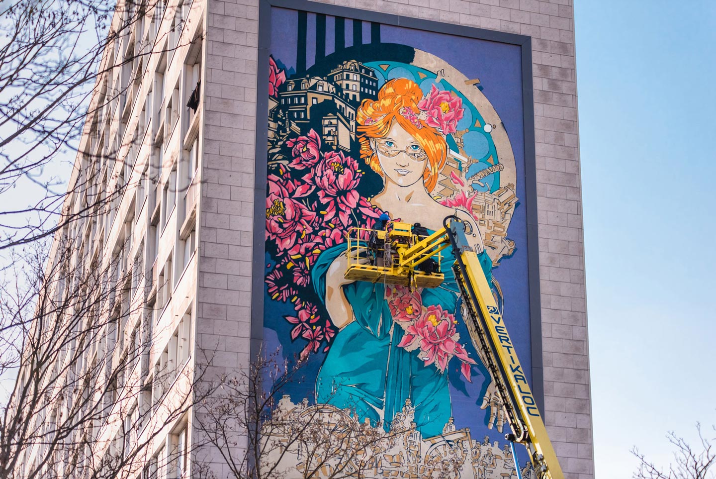 a huge street art mural tribute to mucha