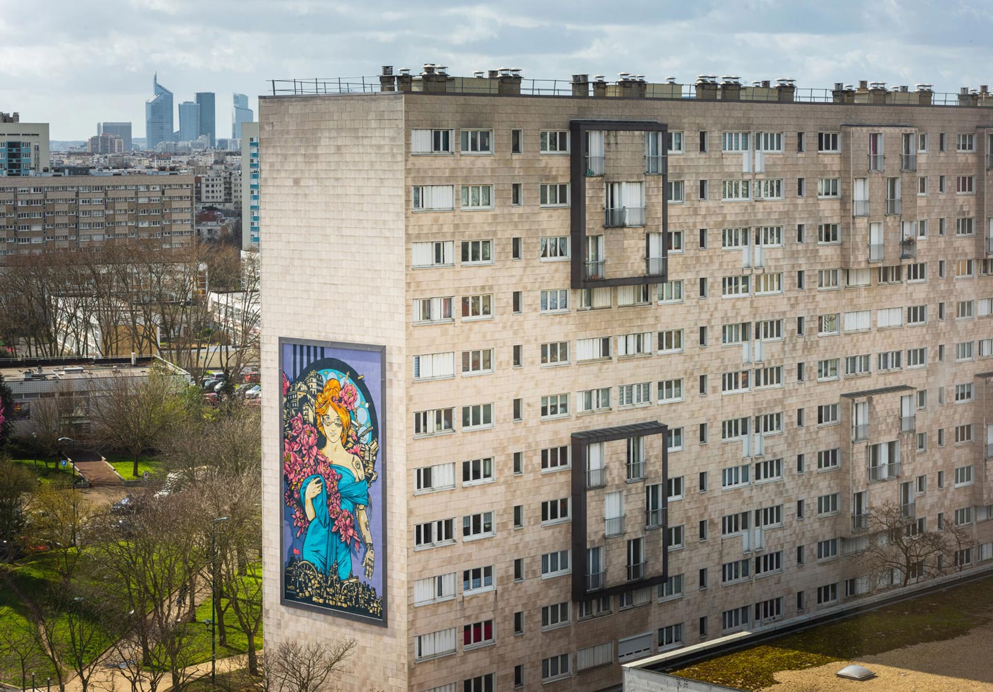 a huge mural with a feminine character tribute to mucha with cyberpunk elements