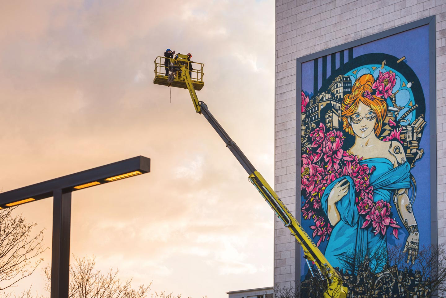 a huge street art mural, an elevator lift on foreground