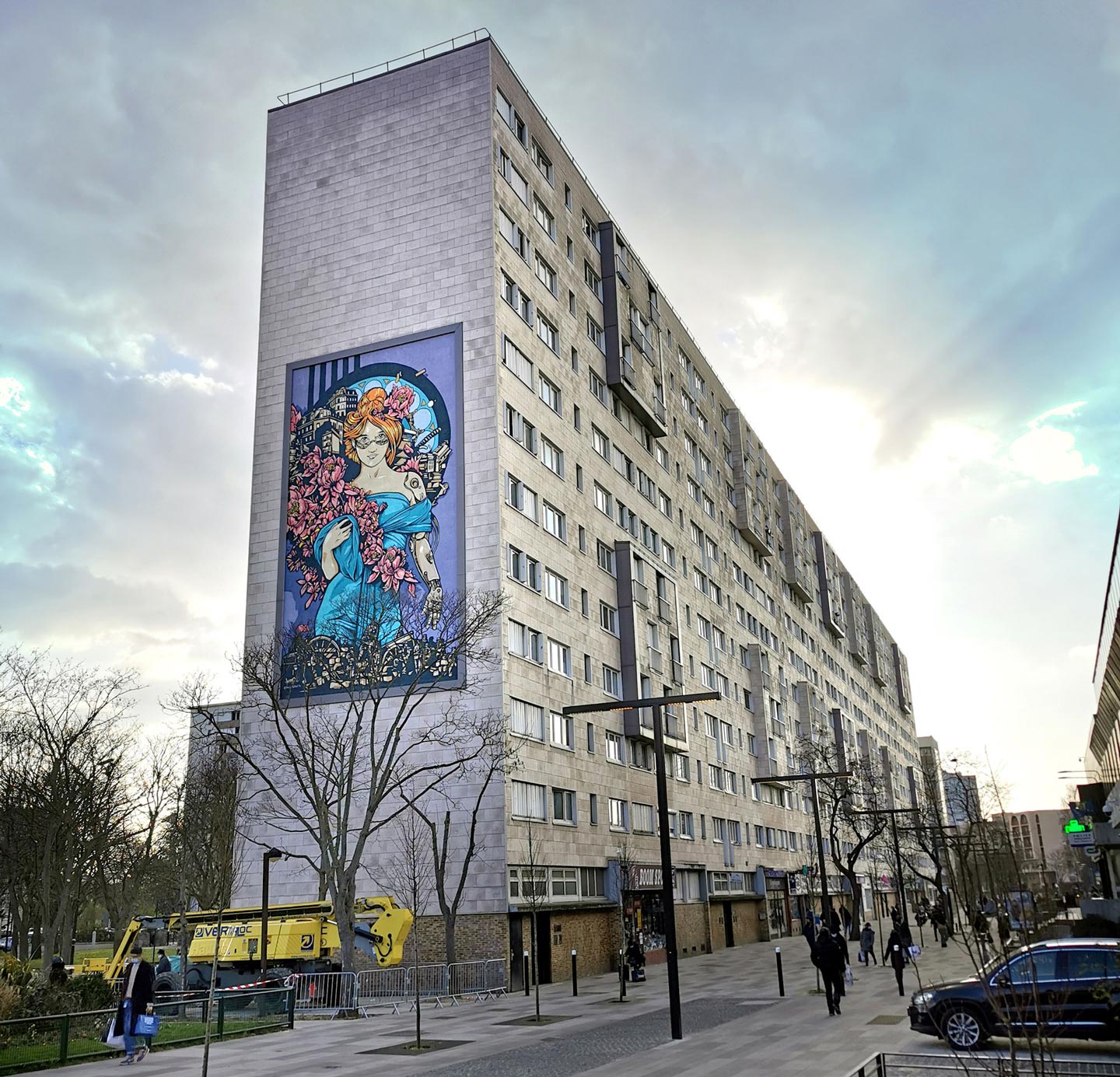 a huge mural with a feminine character tribute to mucha with cyberpunk elements