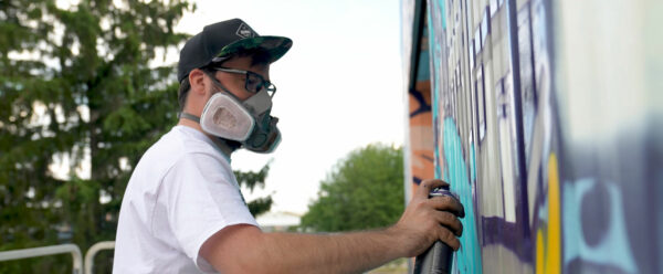 alex kanos is painting a street art mural for secours populaire moselle