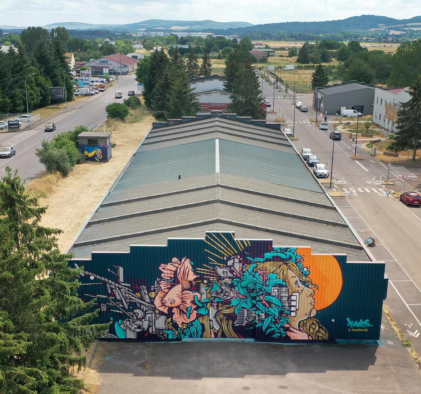 a street art mural made by alex kanos for secours populaire moselle